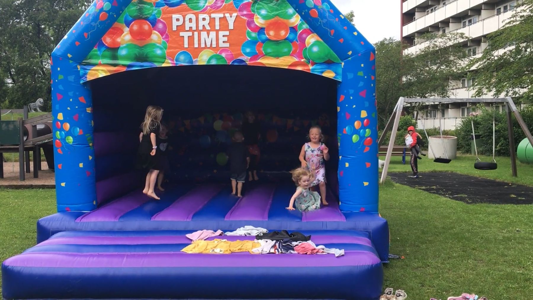 Kids jumping inside a colorful bounce castle