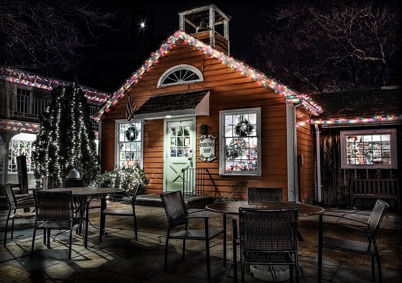 A cabin lit up on a winter night